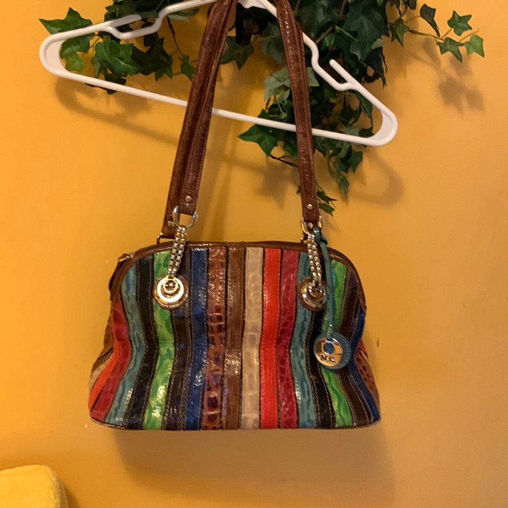 M.C. Purse Multiple colors. In fair Shape got Ink Spot in inside